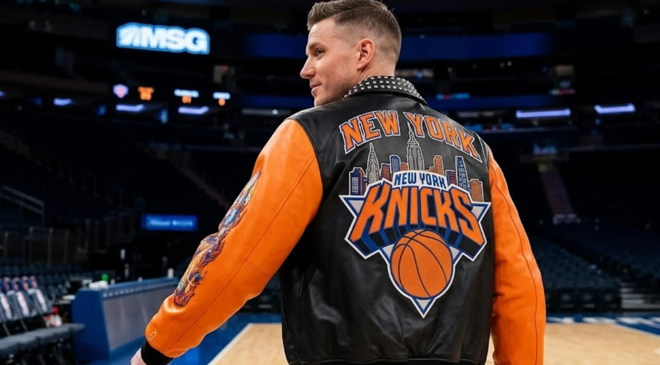 New York Knicks Championship 2026 black and orange leather varsity jacket with studded collar, Finals patches, and Statue of Liberty back graphic