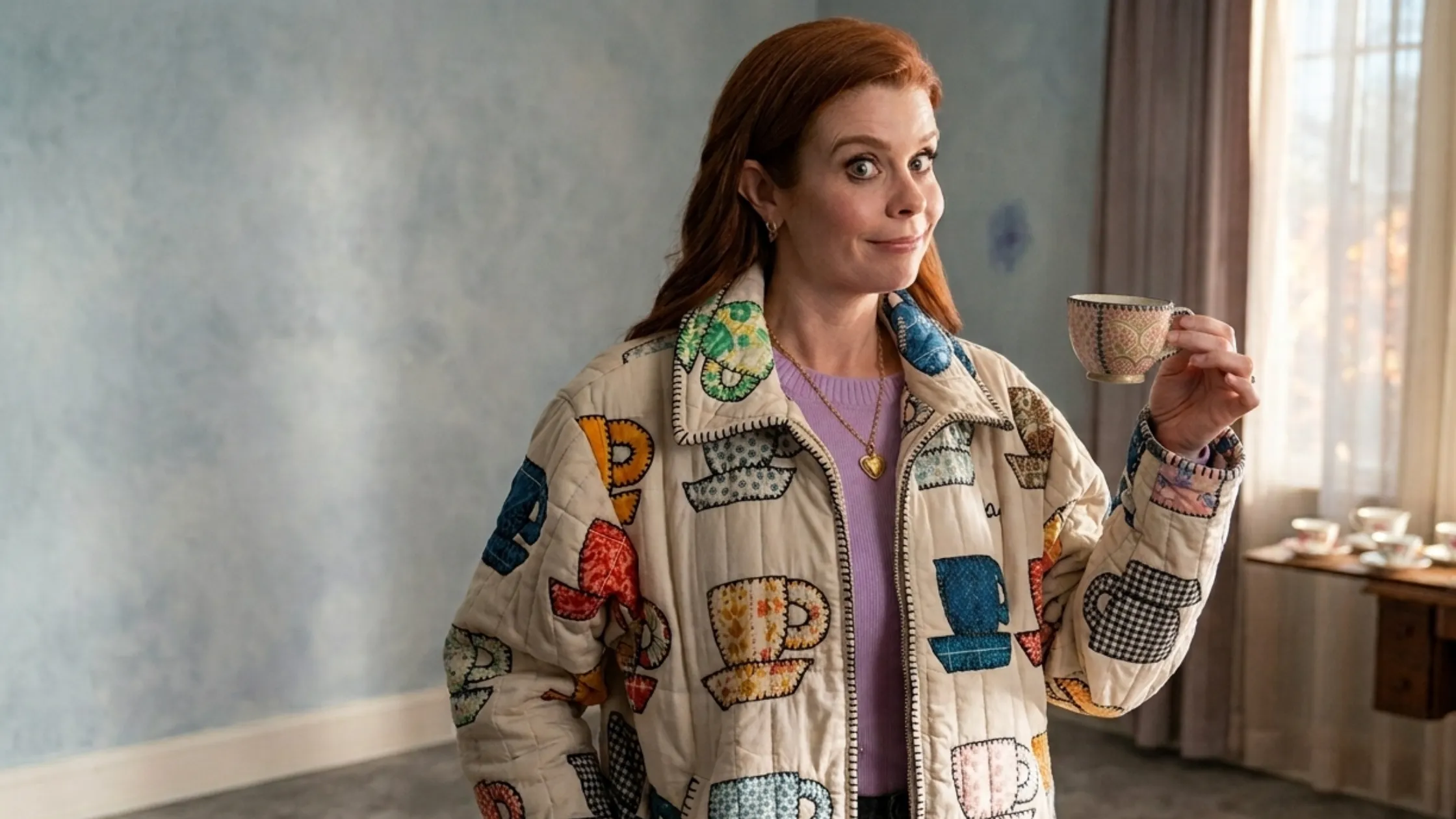 Sweet Magnolias JoAnna Garcia Swisher Tea Cups Print Cream Quilted Jacket with colorful teacup appliqués and black whipstitch edging