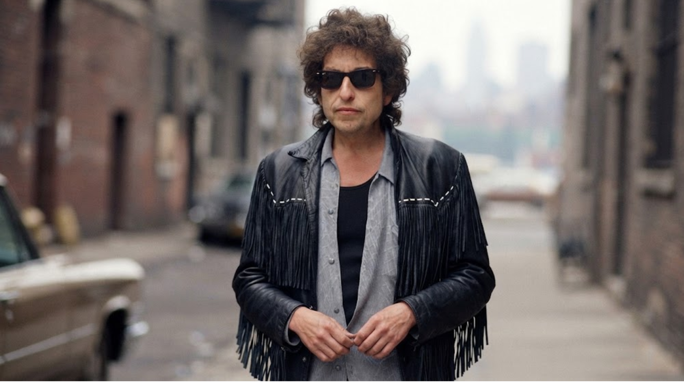 Bob Dylan Fringe Leather Jacket in Black Genuine Leather with White Braided Lacing
