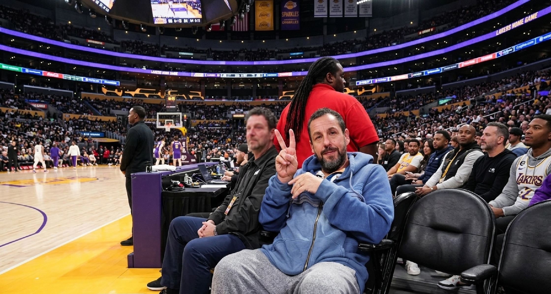 Adam Sandler Minnesota Timberwolves vs LA Lakers blue striped Aviator Nation hoodie worn courtside at Crypto.com Arena 2026