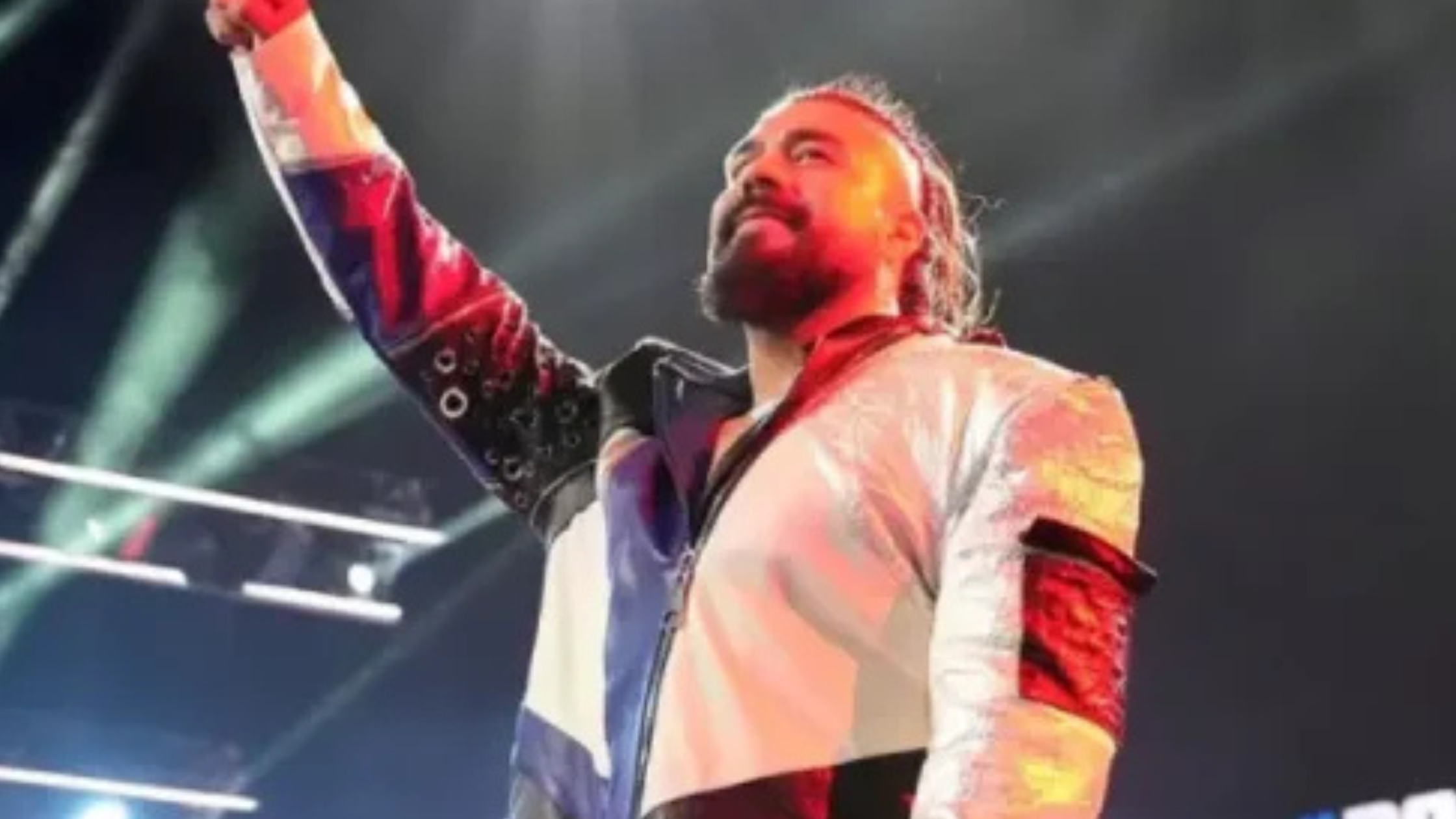 Andrade El Idolo SmackDown 2025 wearing a navy windowpane trench coat with sharp lapels and structured shoulders, showcasing wrestling-inspired fashion.