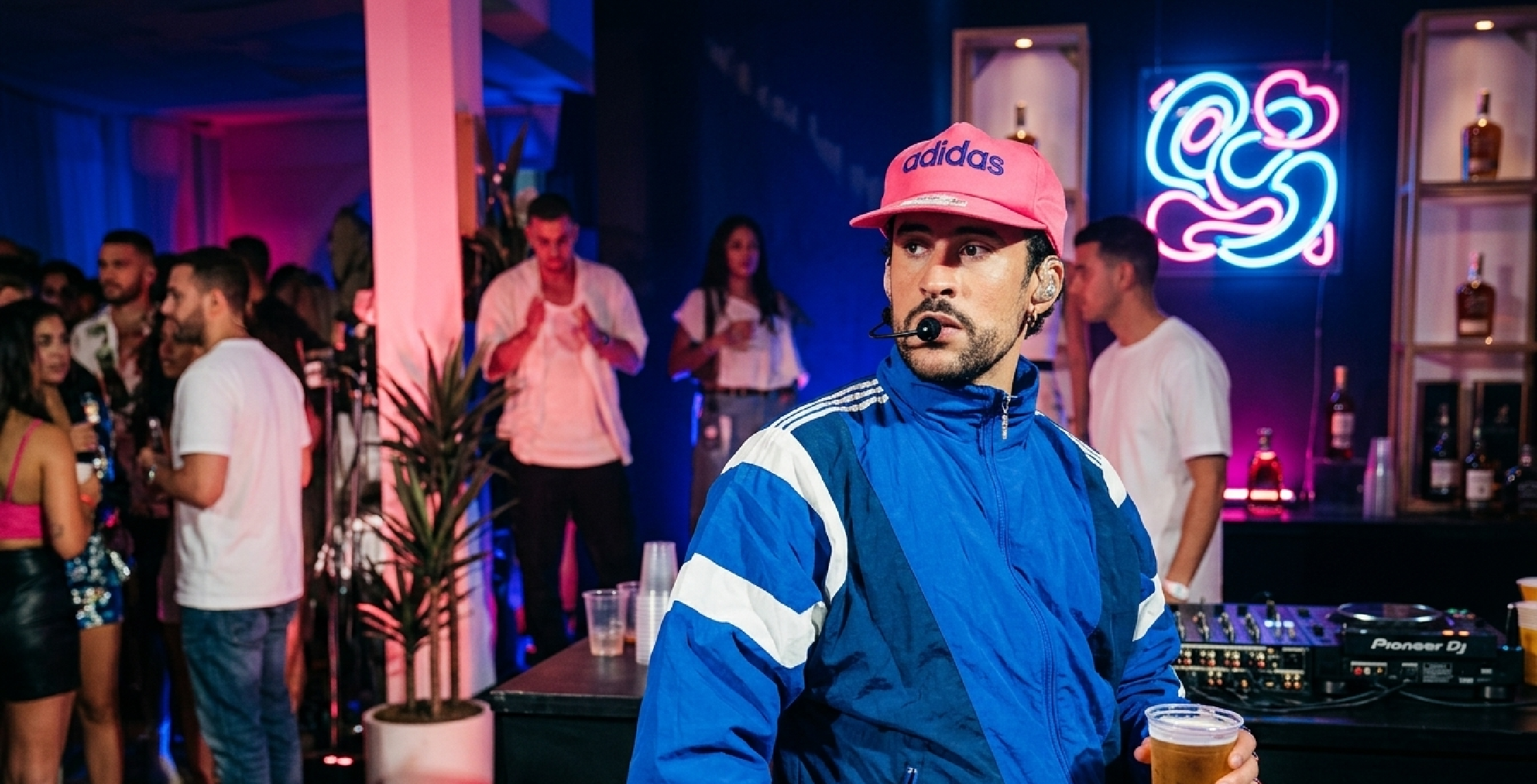 Bad Bunny 2026 tour blue track jacket with Adidas stripes and retro color-block design