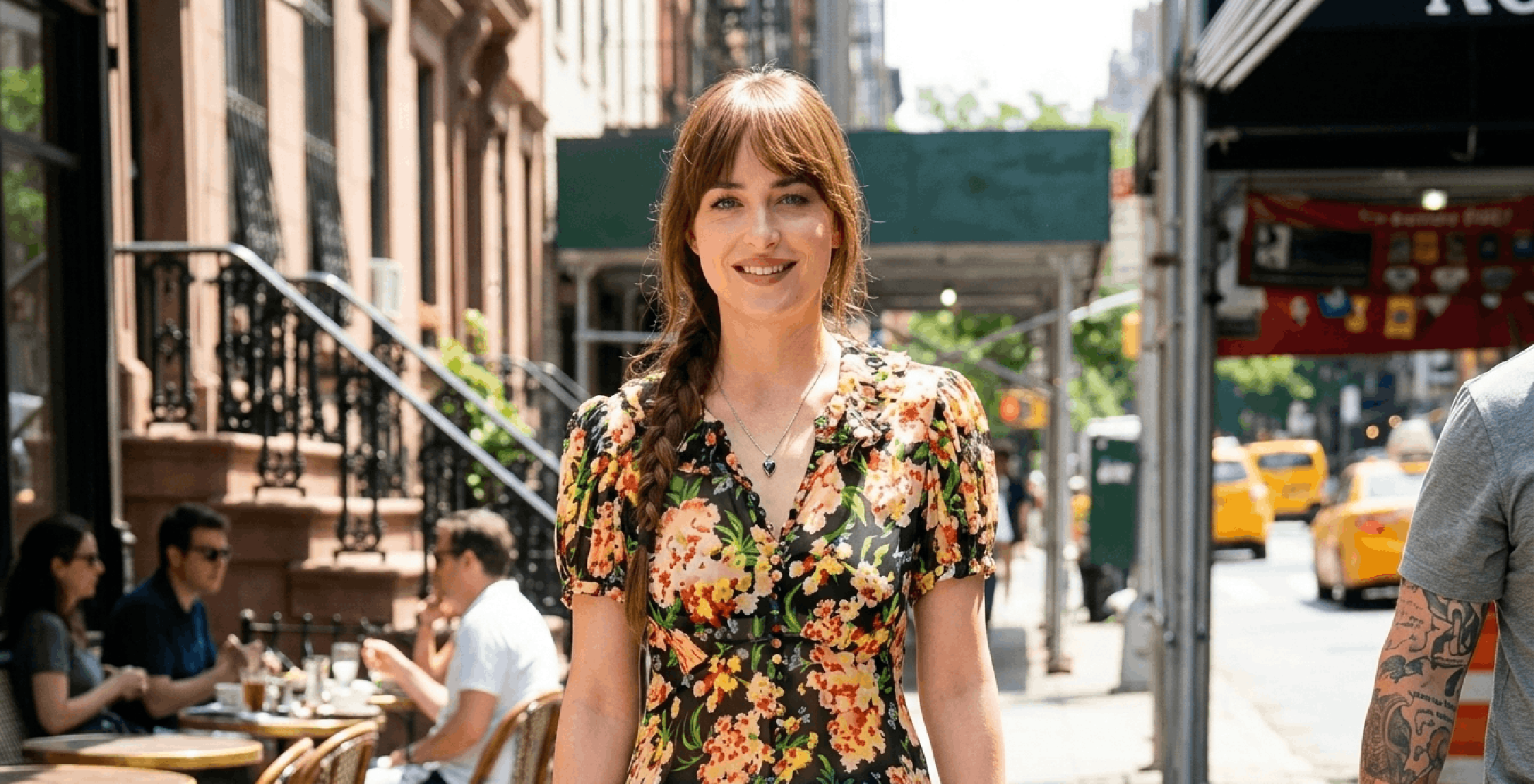 Dakota Johnson Materialists 2025 floral blouse with ruffle trim, puff sleeves, and vibrant black floral print