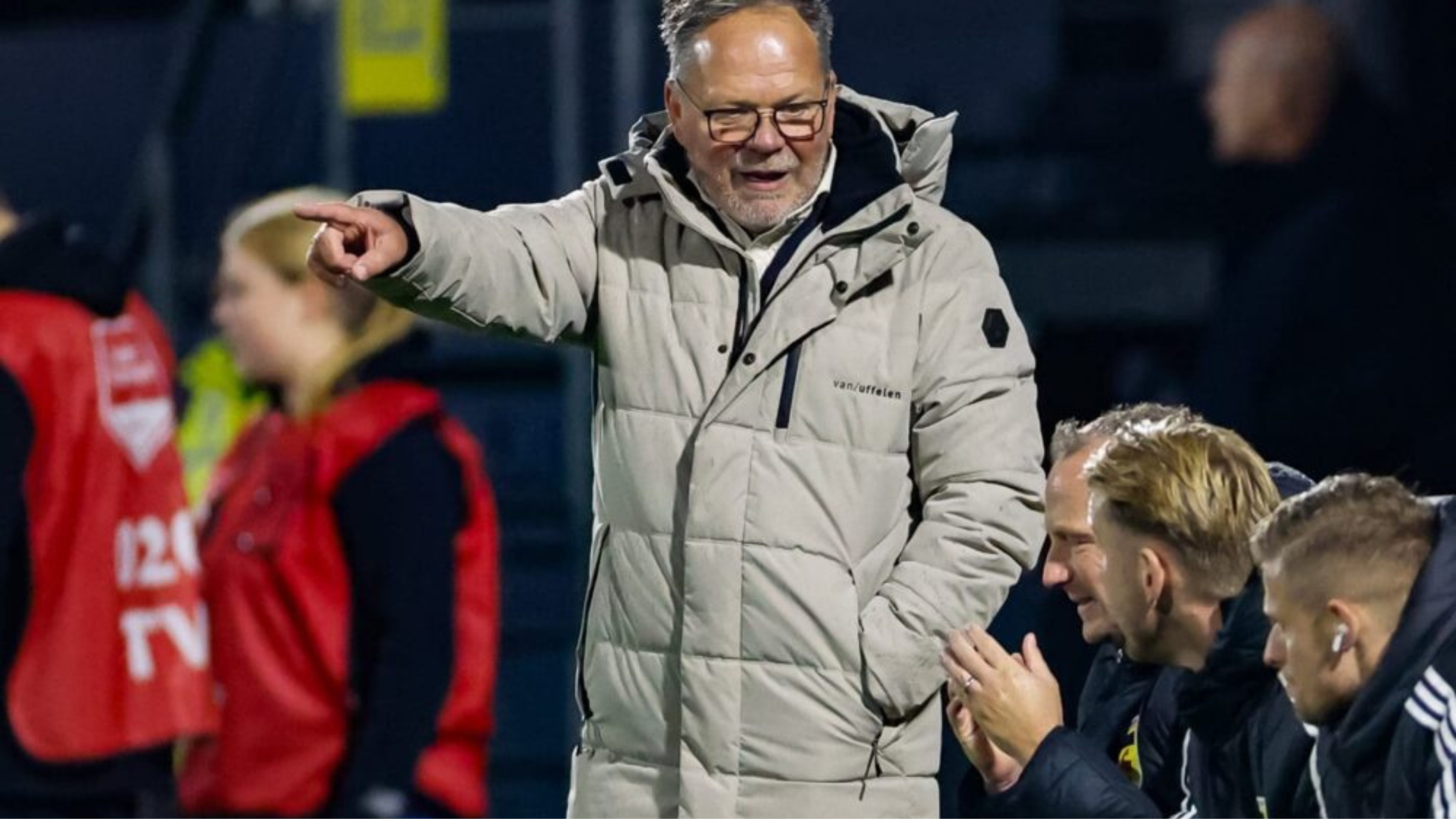 Henk de Jong SC Cambuur beige asymmetric quilted puffer coat with hood and insulated collar worn during Helmond Sport vs SC Cambuur match