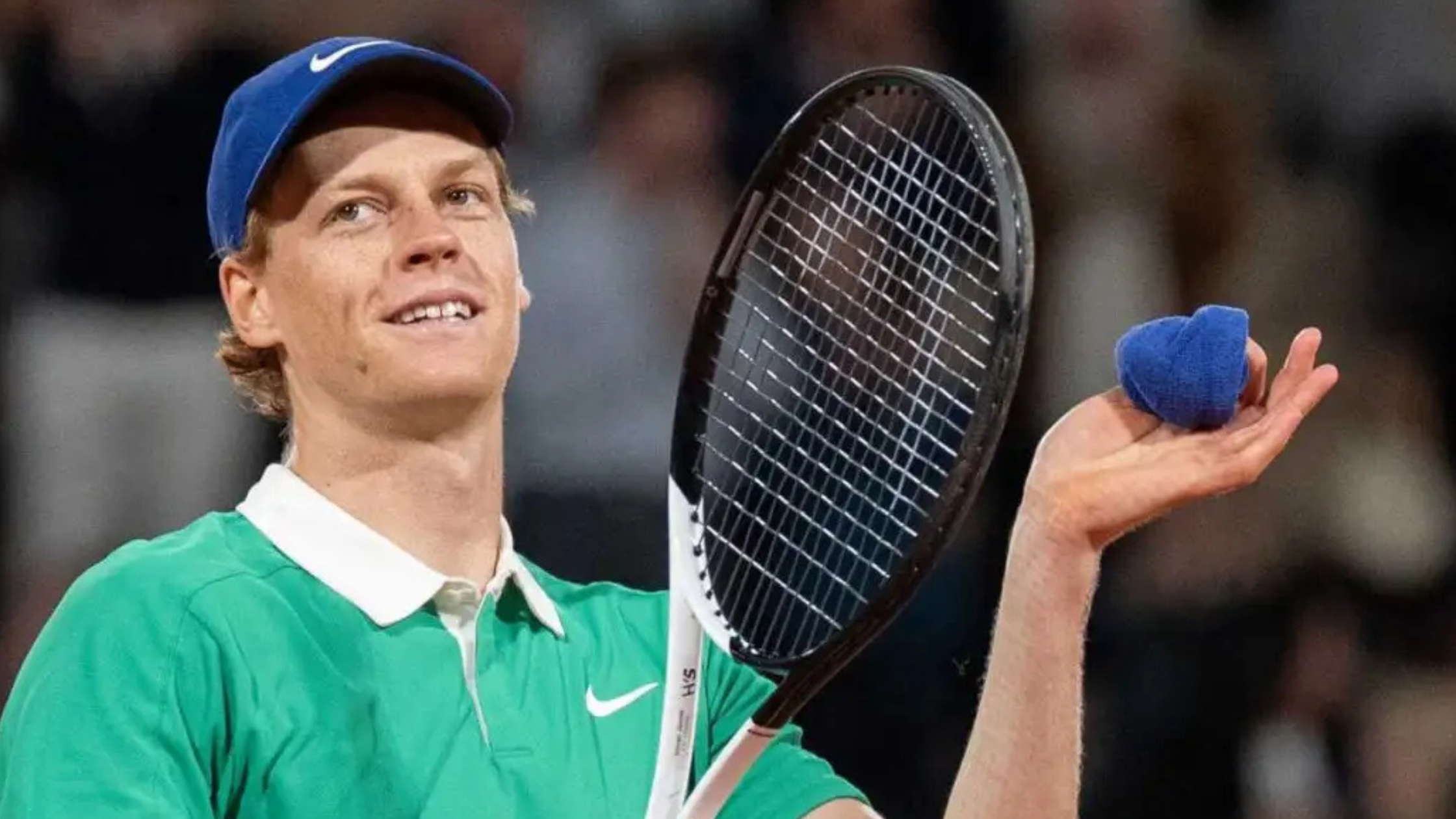 Jannik Sinner wears a sleek maroon Nike Court Dri-FIT Slam shirt during the Nitto ATP Finals, showcasing modern tennis performance style.