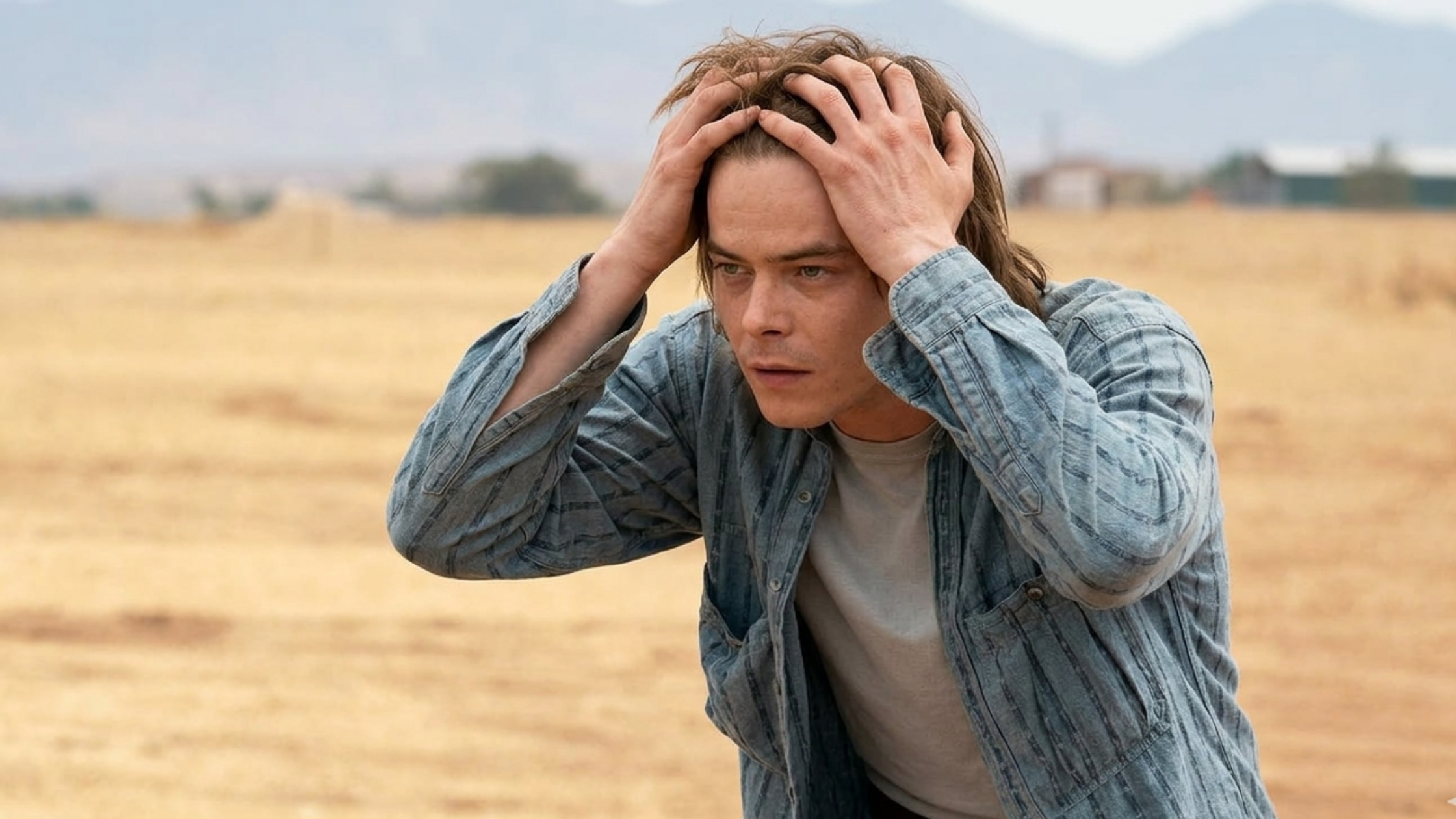 Stranger Things star Charlie Heaton as Jonathan Byers wears a retro graphic tee, patterned cardigan, plaid shirt, and classic denim jackets showcasing his vintage Season 5 style.