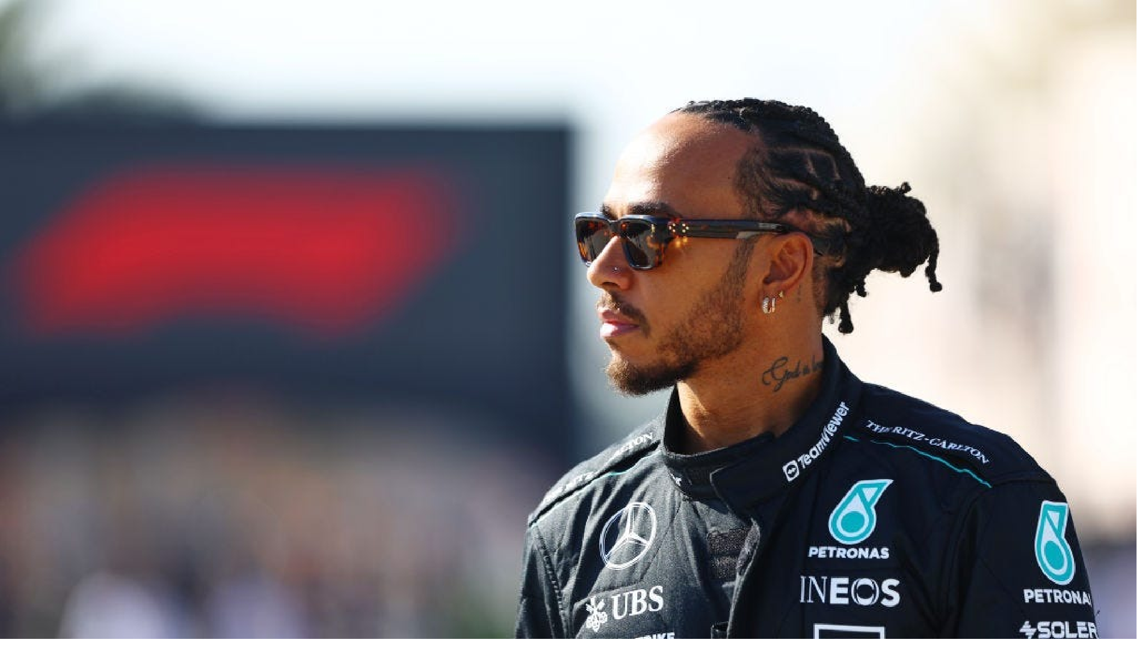 Lewis Hamilton U.S. F1 Grand Prix 2025 bright yellow zip-up hoodie with black drawstrings, featuring LH44 logo on chest and Hamilton graphic on back, streetwear style