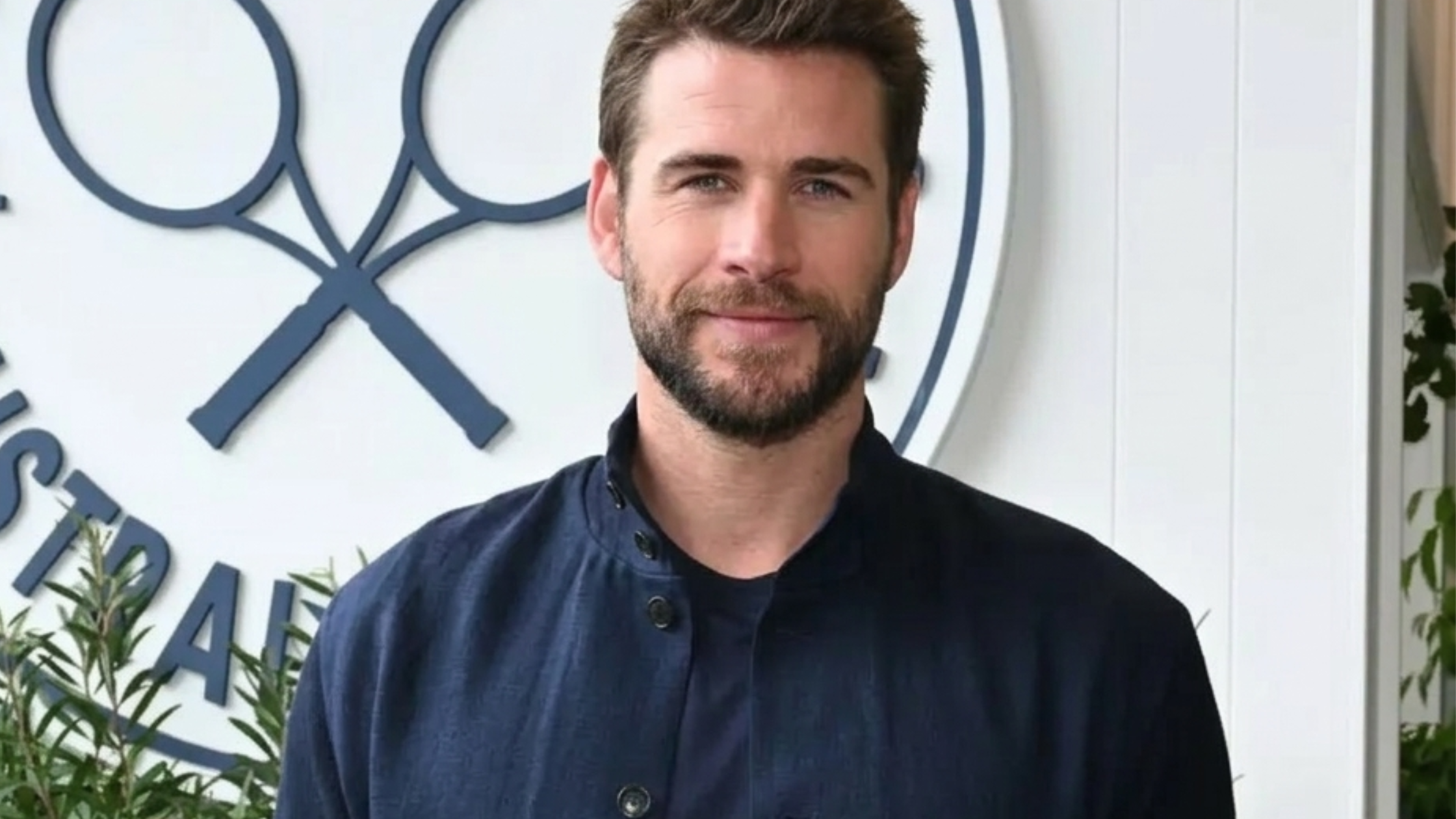 Liam Hemsworth The Australian Open 2026 Jacket midnight navy bomber with mandarin collar and oversized bellows pockets worn at Ralph Lauren dinner.  Select 78 more words to run Humanizer.
