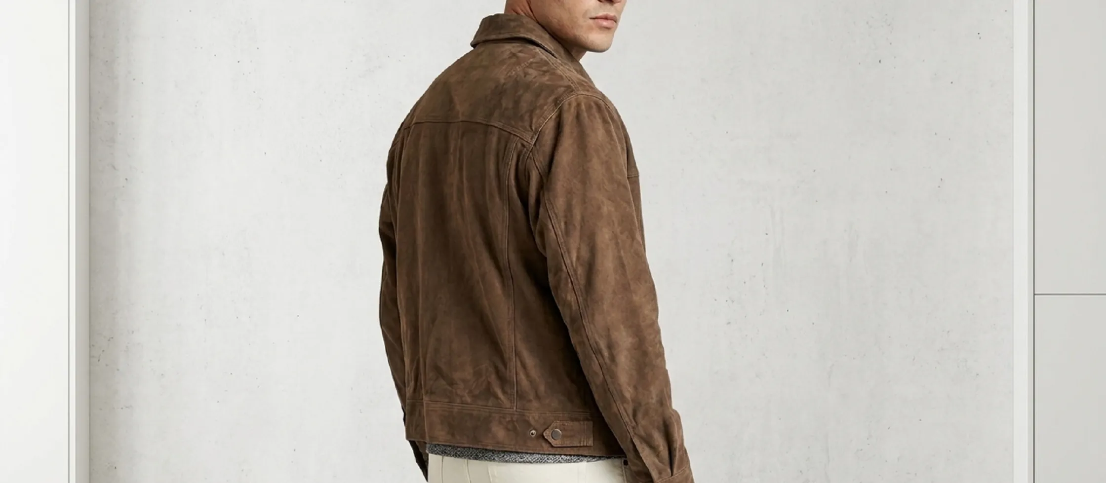 Miguel Alfaro suede trucker jacket in tobacco brown, worn by Niko Pepaj on S.W.A.T. Season 8 Episode 18, featuring a shirt-style collar, snap-button front, adjustable cuffs, and classic trucker yoke.