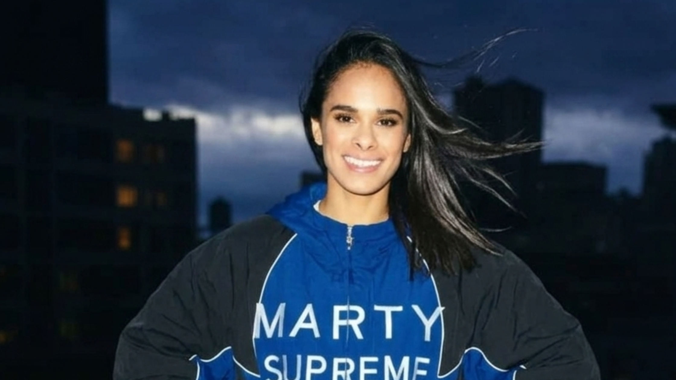 Navy and black Marty Supreme jacket with bold white MARTY SUPREME lettering and Made in America back print inspired by cinematic streetwear style.