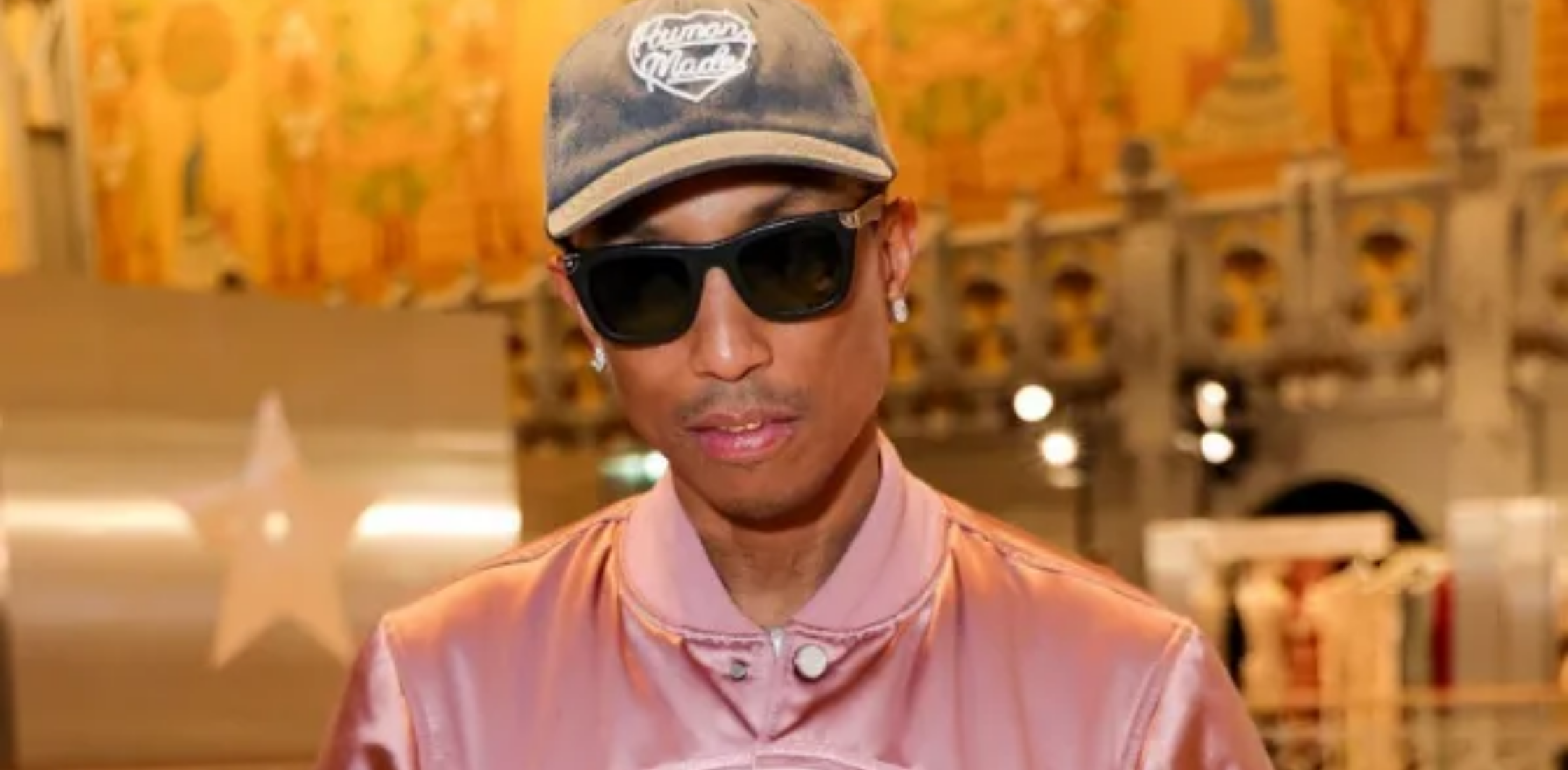 Pharrell Williams LVMH Prize Cocktail satin bomber jacket in dusty rose with floral trapunto detailing, cropped fit, and ribbed cuffs showcasing luxury streetwear style at Paris Fashion Week 2026.