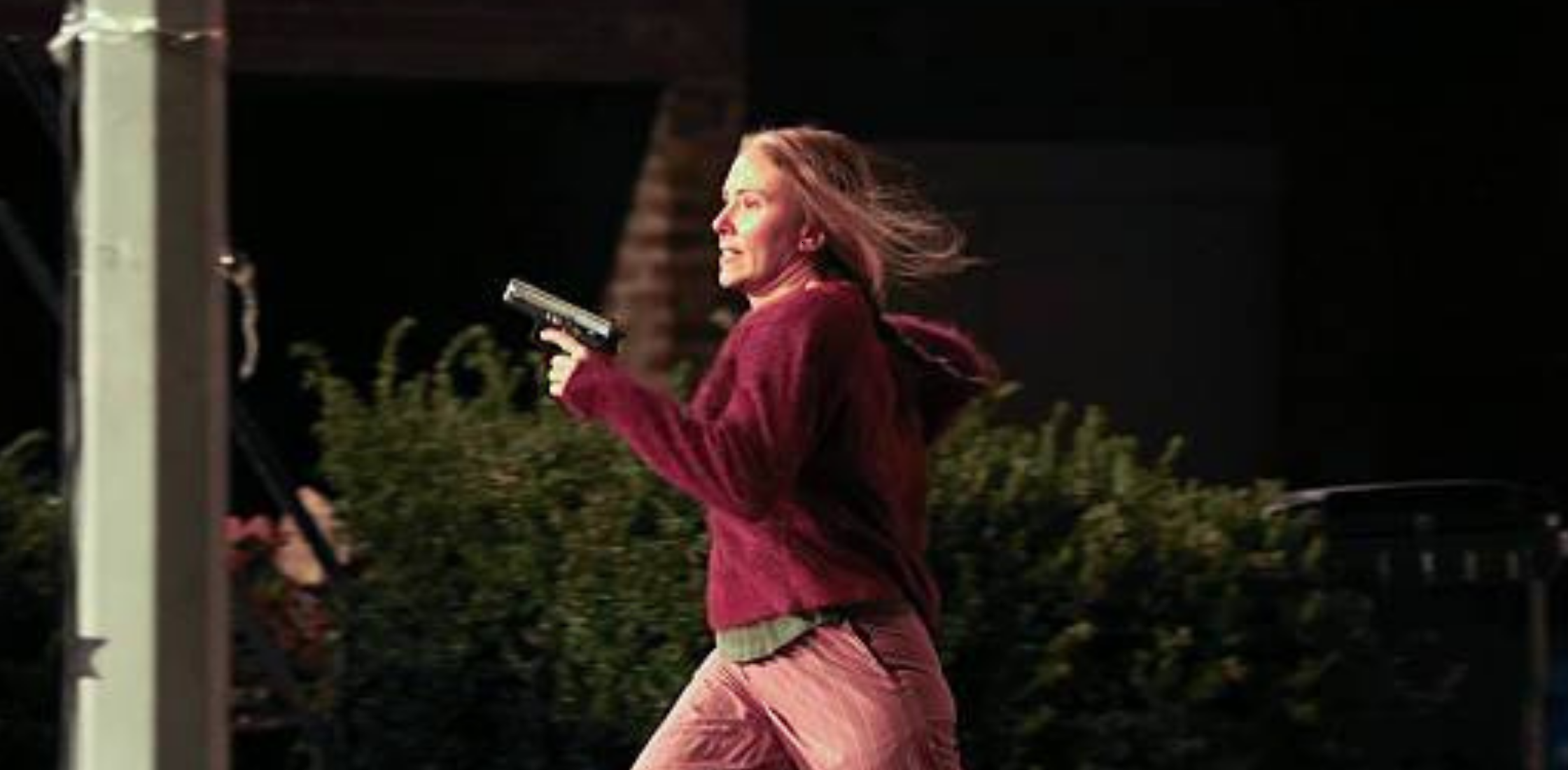 The Exorcist star Scarlett Johansson wears a stylish maroon textured sweatshirt, adding a pop of color to the set.