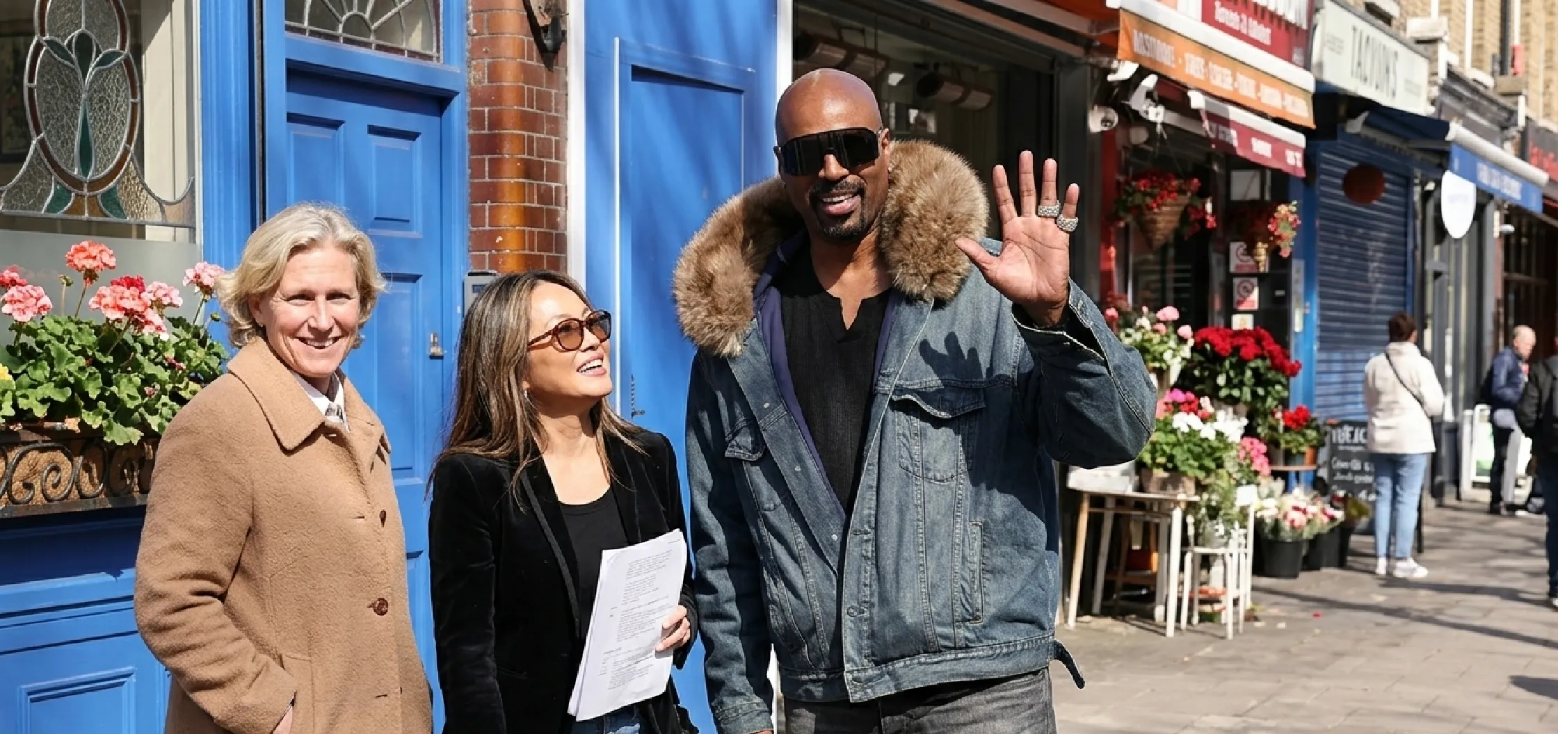 Shawn Wayans wearing oversized acid-wash indigo denim jacket with faux fur collar at Capital XTRA studios London
