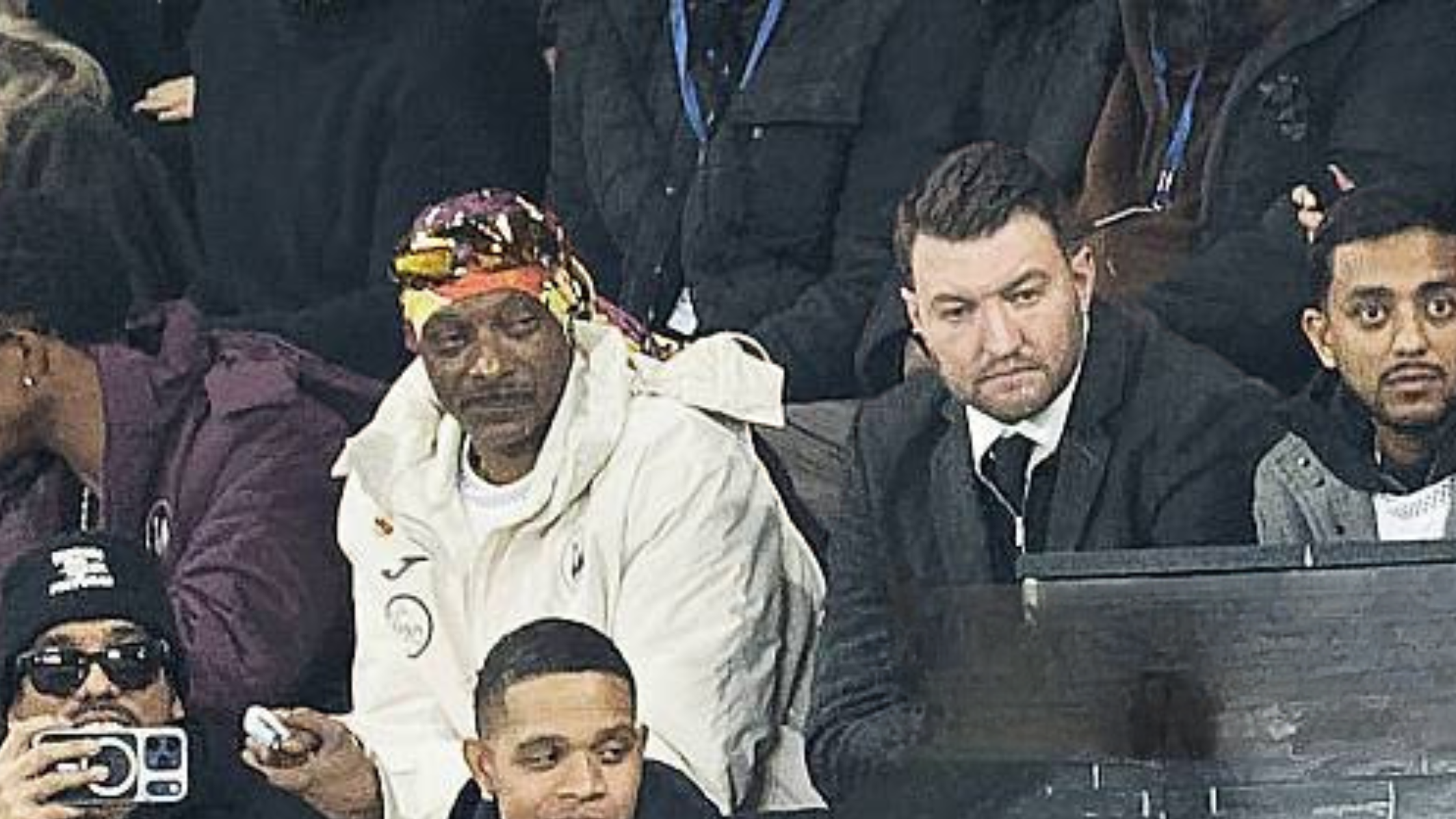 Snoop Dogg sports a stylish white hooded jacket at the Sky Bet Championship match, adding a bold, oversized streetwear edge to the stadium sidelines.