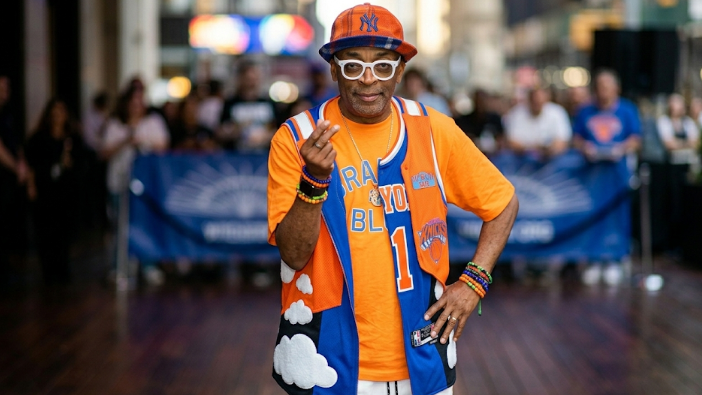 Spike Lee MSG New York Knicks inspired orange and blue colorblock puffer vest with sleeveless design and graphic streetwear detailing