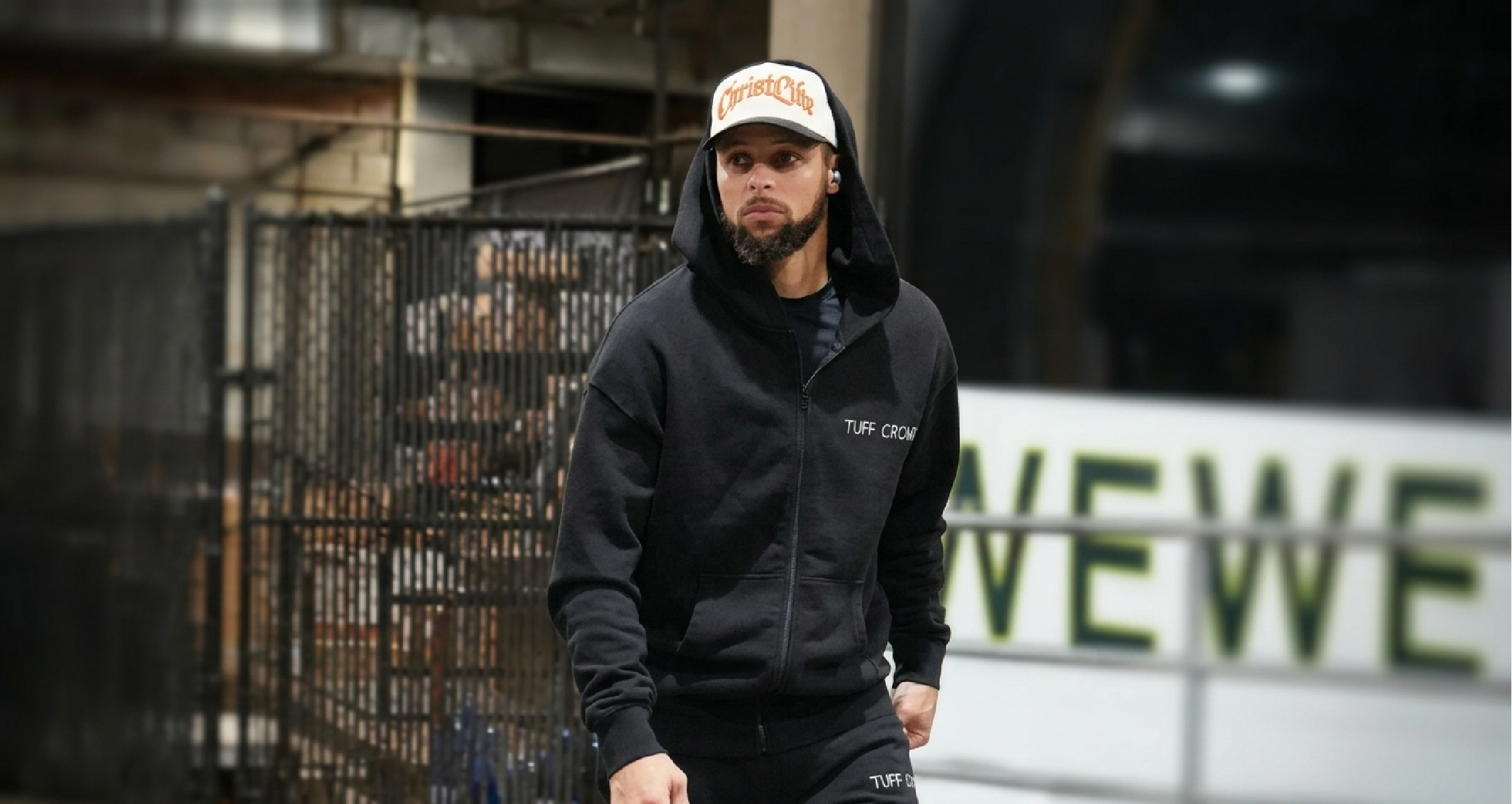 Stephen Curry wearing NBA 2025 black Tuff Crowd full-zip hoodie during tunnel walk