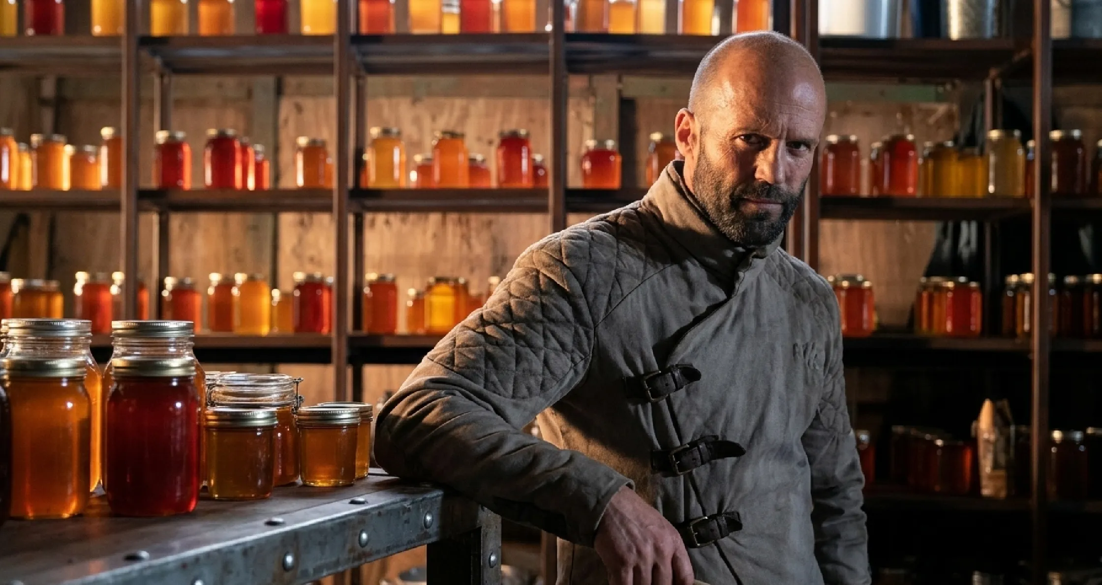 Jason Statham Beekeeper 2 tactical asymmetrical grey jacket with leather straps and honeycomb design
