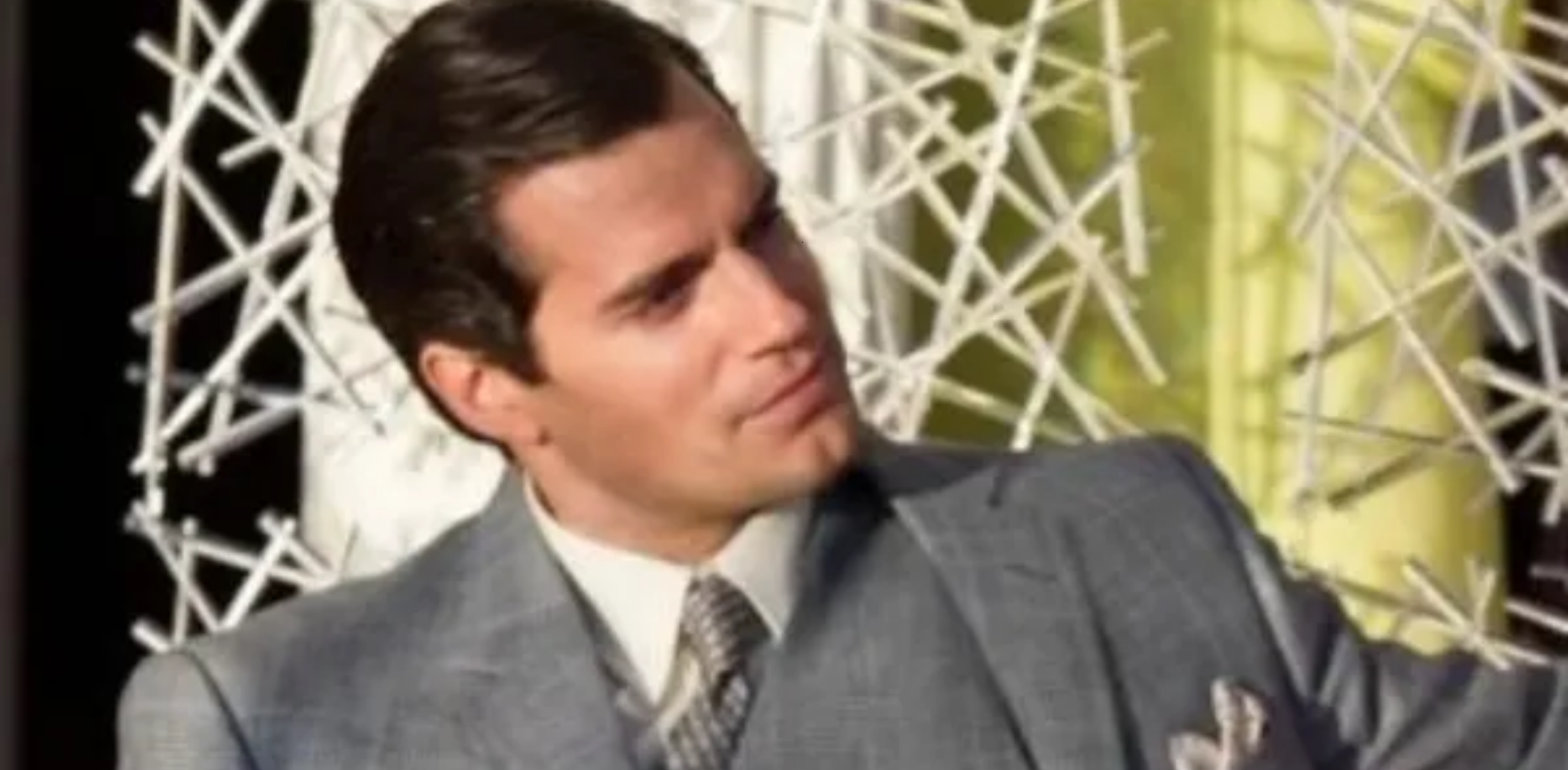 Henry Cavill wearing grey checked suit in The Man from U.N.C.L.E. as Napoleon Solo