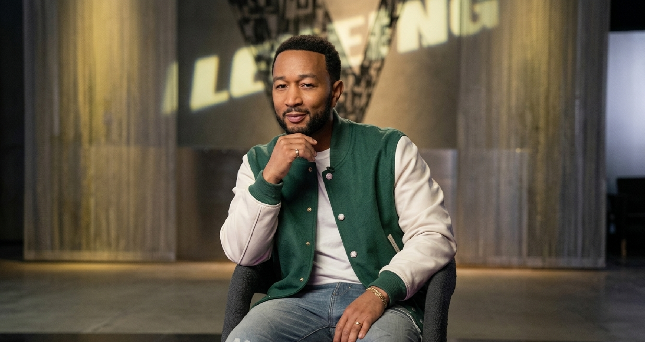 John Legend green varsity jacket with cream leather sleeves, monogram detailing, and snap button front from The Voice Season 29 Episode 06.
