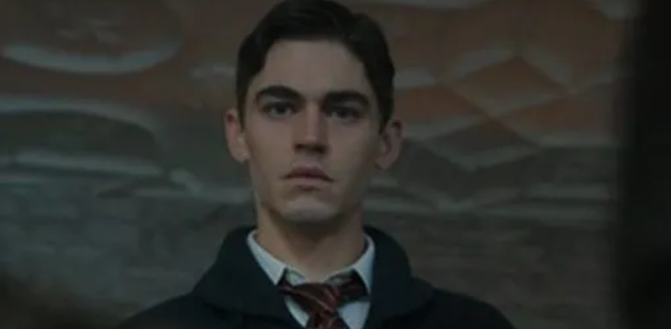 Young Sherlock Hero Fiennes Tiffin black shawl collar ribbed cardigan with button front and patch pockets, classic academic style inspired by Hero Fiennes Tiffin